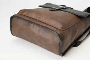 Retro brown PU leather backpack detail view, stylish casual travel school bag for men.