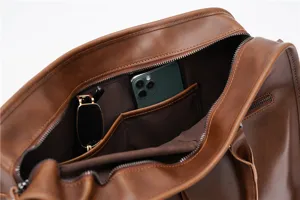 Detailed view of the brown leather business briefcase interior with multiple storage pockets.