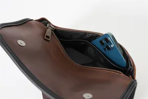 Detail view of casual PU leather crossbody bag interior compartment showing ample phone storage space.