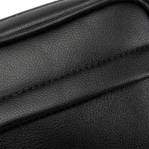 Black PU leather chest bag close-up showing fine texture and durable stitching detail.