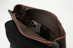 Detailed view of the retro backpack interior, featuring zipper pockets and large storage space.