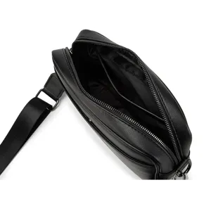 Detailed view of black PU leather men crossbody bag interior compartments zipper pocket.