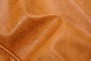 Premium brown leather texture detail of vintage retro crossbody shoulder bag style design.