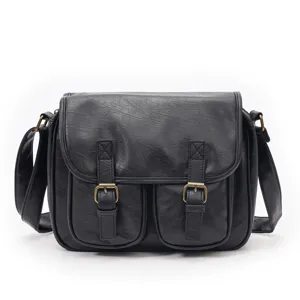 Vintage black PU leather messenger bag detail, retro crossbody bag with dual front pockets.