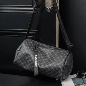 Casual barrel crossbody bag for men and women, stylish cylinder shoulder bag with strap.