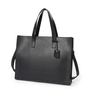 Detailed view of black PU leather tote bag, textured surface, durable handles and strap.