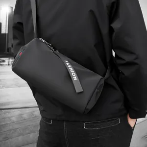 Black cylindrical crossbody bag for men and women, casual fashion shoulder bucket bag.
