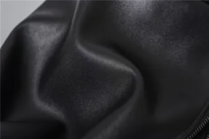 Black leather bag texture detail shot, simple casual daily crossbody bag lightweight.