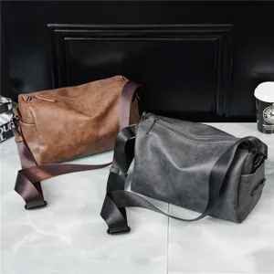 Cylinder messenger bag detail showcasing soft leather texture and durable zipper closure.