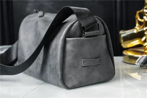 Grey cylinder shoulder bag detail view, casual crossbody design for men, stylish daily use.