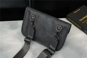 Mens dark gray retro crossbody chest bag detail shot showing metal hardware and durable strap.
