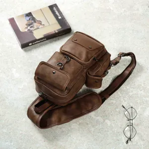 Men vintage leather chest bag detail, multi-pocket sling shoulder bag with metal hardware.