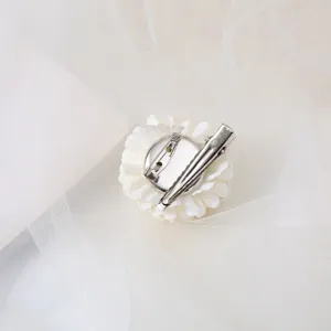 Back detail of the 4cm white floral hair clip and brooch, showing metal clip and pin design.