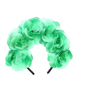 Close-up detail showing the vibrant green artificial fabric rose flower party headband.