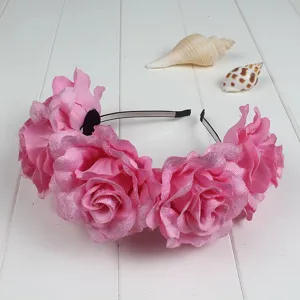 Pink fabric rose flower headband detail shot, gorgeous floral hair accessory for parties.