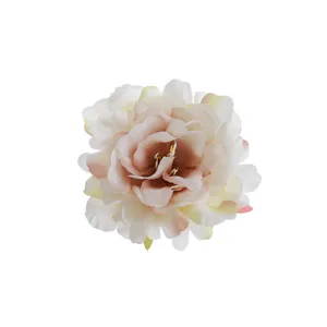 Close-up detail of artificial peony flower head, soft fabric petals, elegant floral accessory.