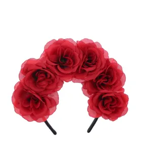 Red artificial rose floral hair hoop detail view, perfect for festival and party dress-up.