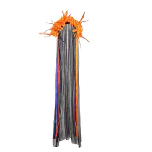 Detail shot of Halloween festival hair hoop with orange flowers, feathers and long black veil.