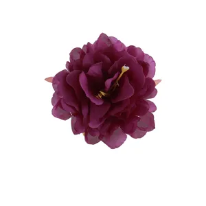 Detailed close-up shot of the deep purple artificial peony flower petal texture and center.