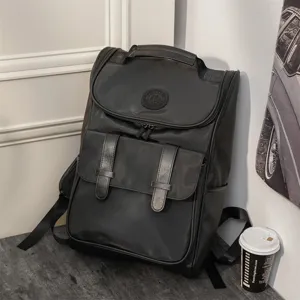 Casual stylish black backpack for men and women, large capacity travel school daypack bag.