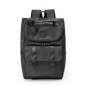 Black large capacity backpack detail view, durable waterproof fabric with front leather pockets.