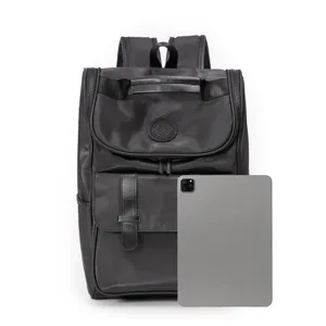 Black large capacity casual travel backpack for men and women, detailed view with tablet.