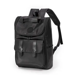 Detail view of a black casual backpack with front pockets and comfortable shoulder straps.