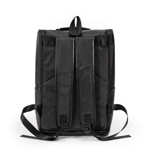 Close up detail of the black waterproof minimalist backpack back straps and handle structure.