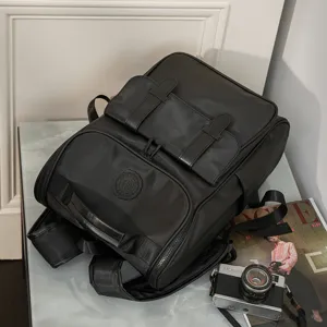 Stylish black travel backpack for men and women, large capacity casual school bookbag.