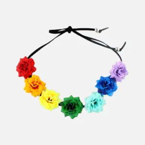 Detailed view of bohemian floral headband with seven colorful fabric flowers and black cord.