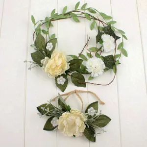 Bohemian artificial peony floral wreath and matching sash set detail, elegant holiday hair decor.