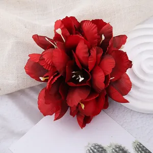 Dark red artificial flower hair clip detail, perfect for Hawaiian beach vacation and boho style.
