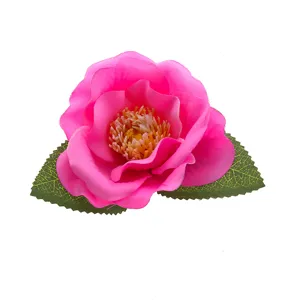 Close-up detail of a vibrant pink artificial flower head with realistic green leaves attached.