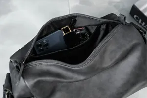 Men cylinder shoulder bag interior detail showing spacious storage capacity with daily items.