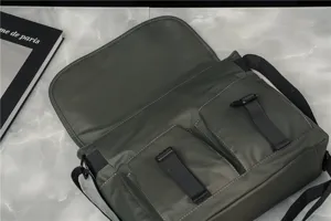 Waterproof oxford cloth messenger bag, retro casual shoulder bag with dual pockets.