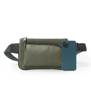 Stylish olive green chest bag for men, featuring durable zippers and adjustable strap.
