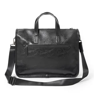 Vista dettagliata della borsa in pelle nera, con manici resistenti e cerniere metalliche.