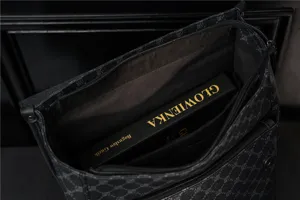 Black monogram travel backpack interior detail, large capacity casual daypack for men.