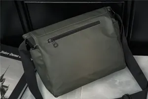 Waterproof oxford cloth messenger bag for men, casual retro single shoulder crossbody bag detail view.