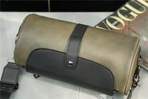 Detailed view of vintage cylinder shoulder bag, green and black color block with flap design.