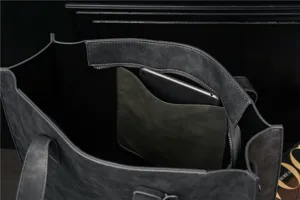 Dark grey PU leather tote bag interior detail view showing spacious storage pocket design.
