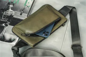 Stylish green leather men's chest bag with crossbody strap and front phone pocket detail.