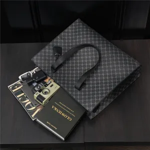 Detailed view of the PU leather tote bag styled with lifestyle props on a dark wooden table.