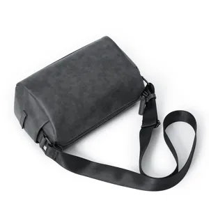Dark grey cylindrical shoulder bag for men, simple casual crossbody bag with adjustable strap.