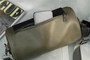 Vintage cylindrical shoulder bag for men and women, stylish retro crossbody bag with zipper pocket.