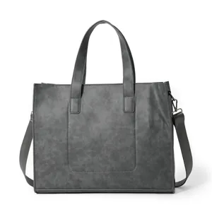 Grey PU leather tote bag detail, featuring dual top handles and detachable shoulder strap.