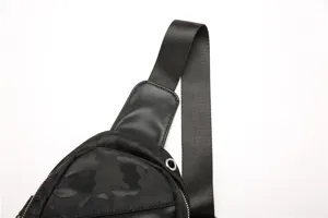 Men black camo sling bag detail showing durable nylon strap and metal eyelet design.