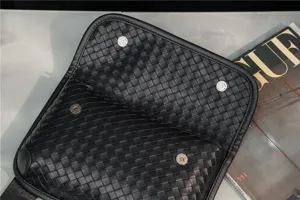 Black leather woven chest bag, stylish casual crossbody bag for men and women detail view
