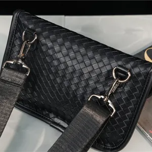 Black woven leather chest bag for men and women, stylish casual shoulder crossbody bag daily use.