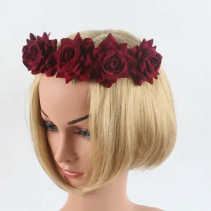Detail of dark red velvet rose flower crown headband, elegant bridal hair accessory for party.